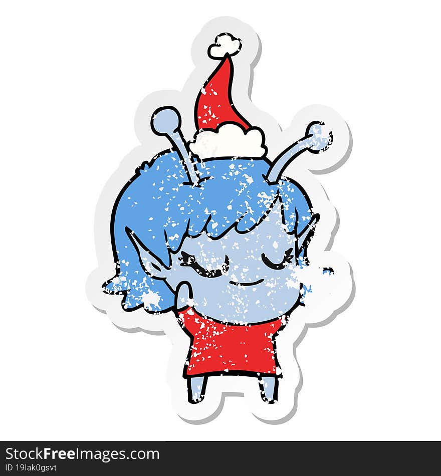 smiling alien girl distressed sticker cartoon of a wearing santa hat