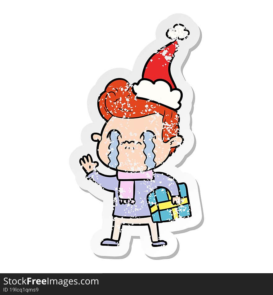 distressed sticker cartoon of a man crying wearing santa hat