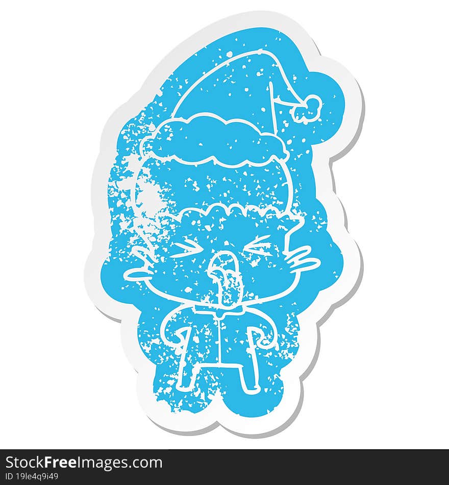 weird quirky cartoon distressed sticker of a alien wearing santa hat