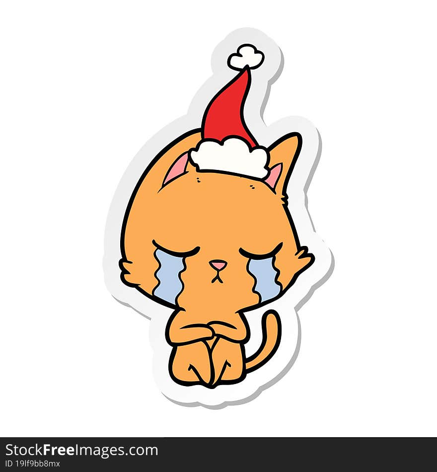 crying sticker cartoon of a cat sitting wearing santa hat