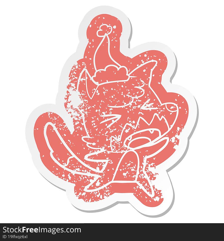 angry cartoon distressed sticker of a fox wearing santa hat