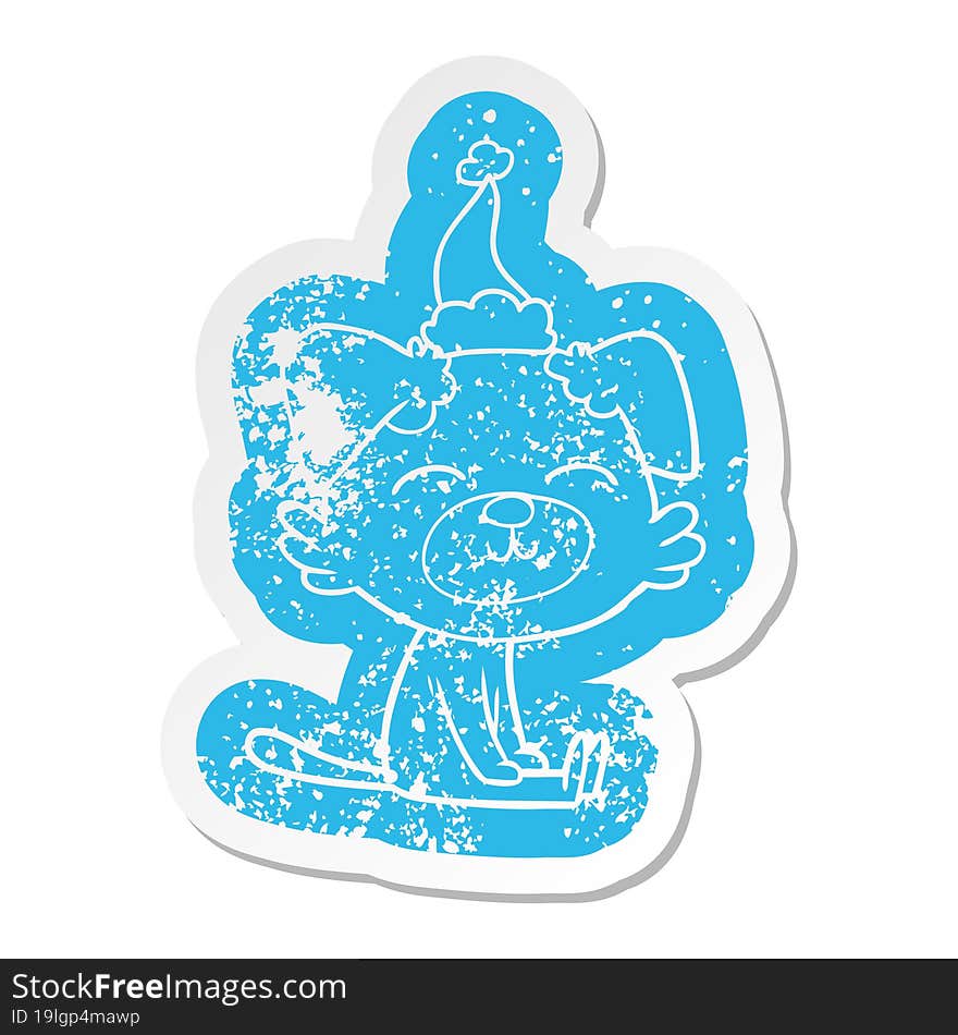 quirky cartoon distressed sticker of a dog wearing santa hat