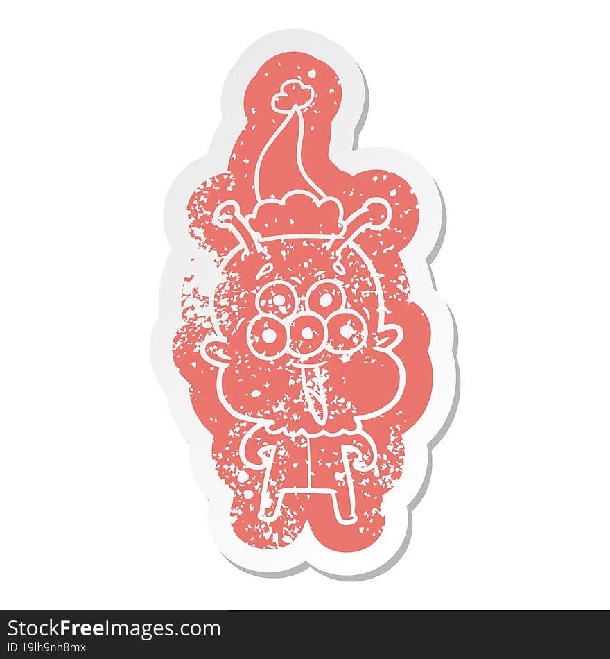 happy cartoon distressed sticker of a alien wearing santa hat