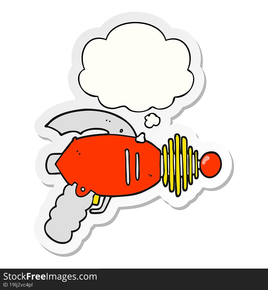 cartoon ray gun and thought bubble as a printed sticker