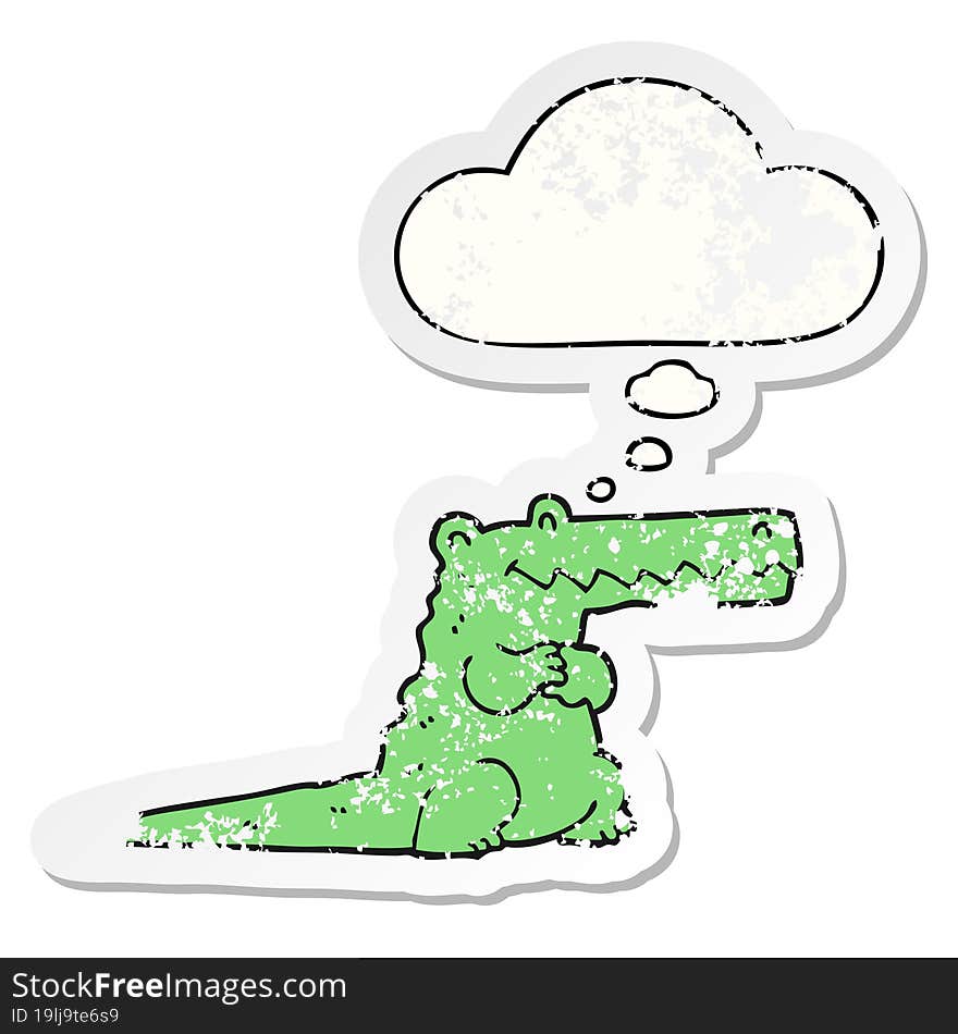 cartoon crocodile and thought bubble as a distressed worn sticker