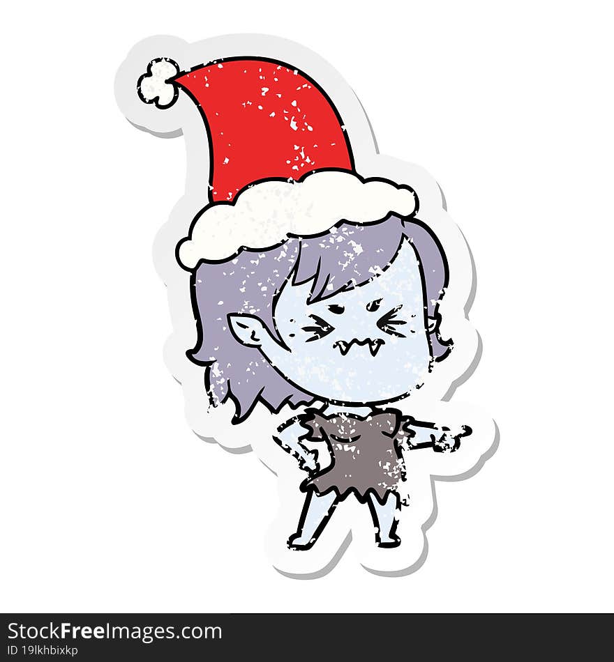 annoyed distressed sticker cartoon of a vampire girl wearing santa hat