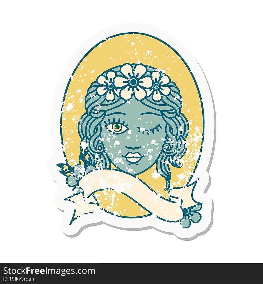 worn old sticker with banner of a maiden with crown of flowers winking