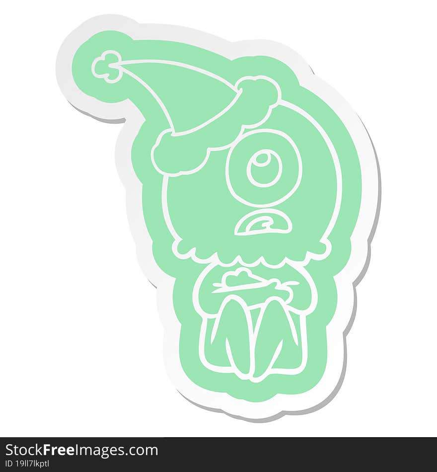 quirky cartoon  sticker of a cyclops alien spaceman wearing santa hat