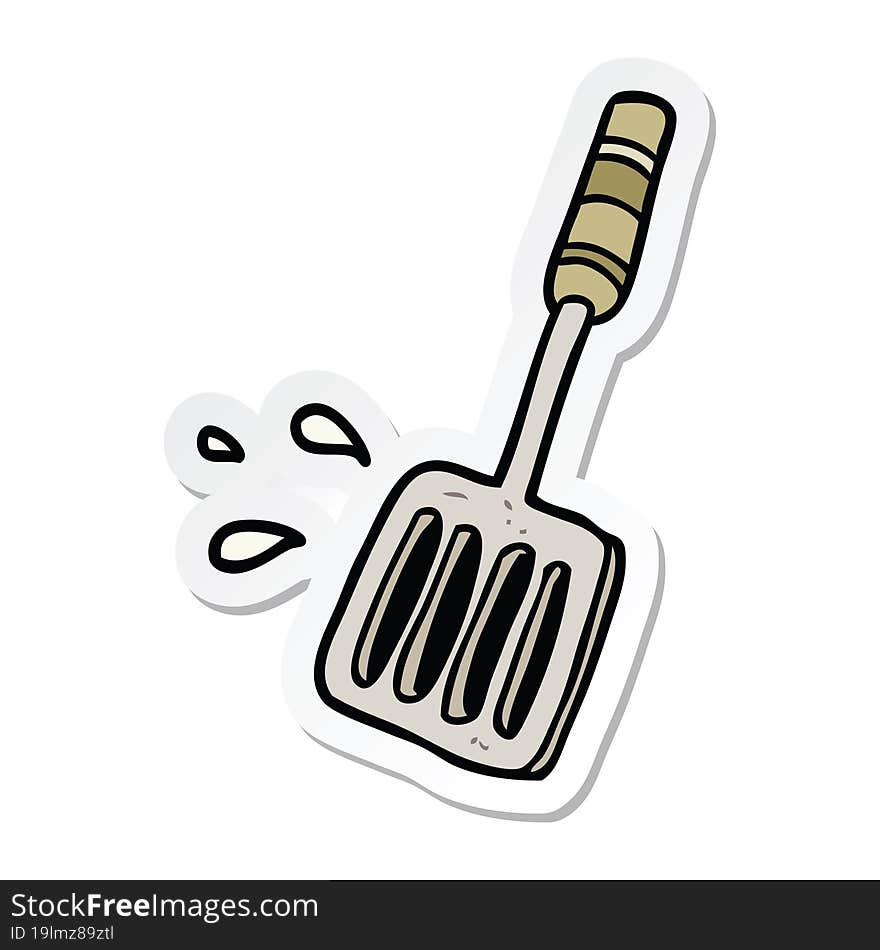 sticker of a cartoon kitchen spatula