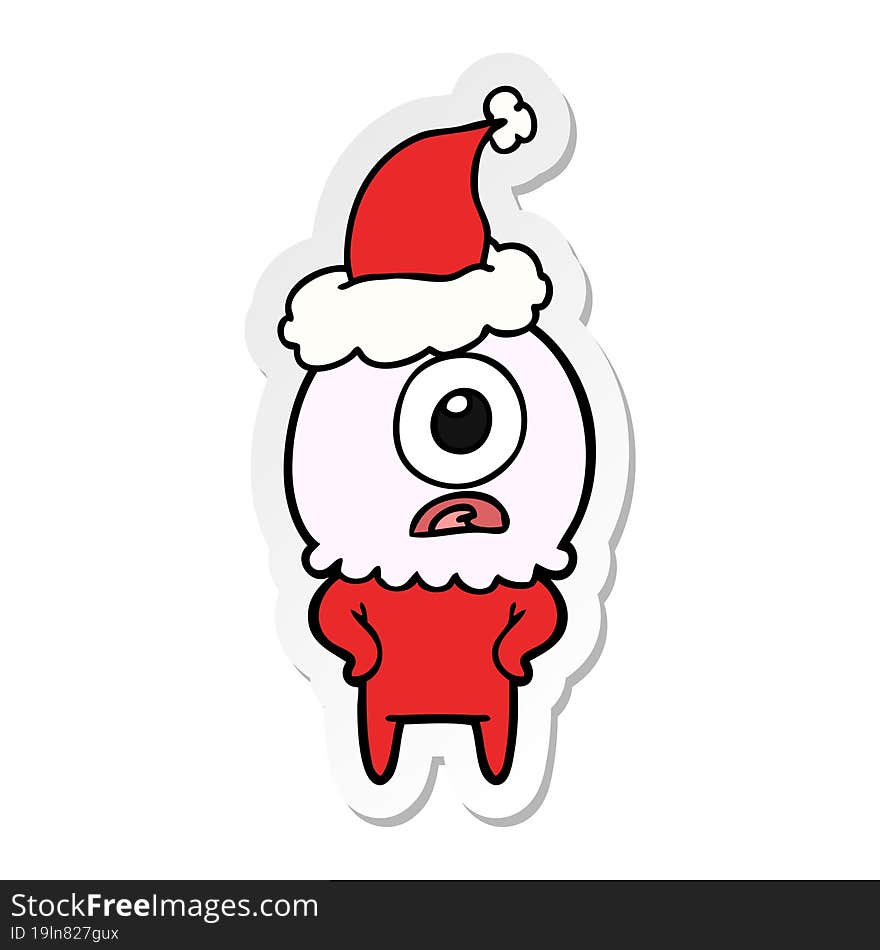 hand drawn sticker cartoon of a cyclops alien spaceman wearing santa hat