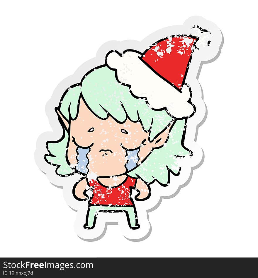 distressed sticker cartoon of a crying elf girl wearing santa hat