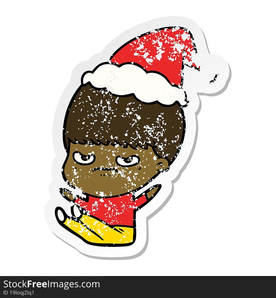 hand drawn distressed sticker cartoon of a boy wearing santa hat