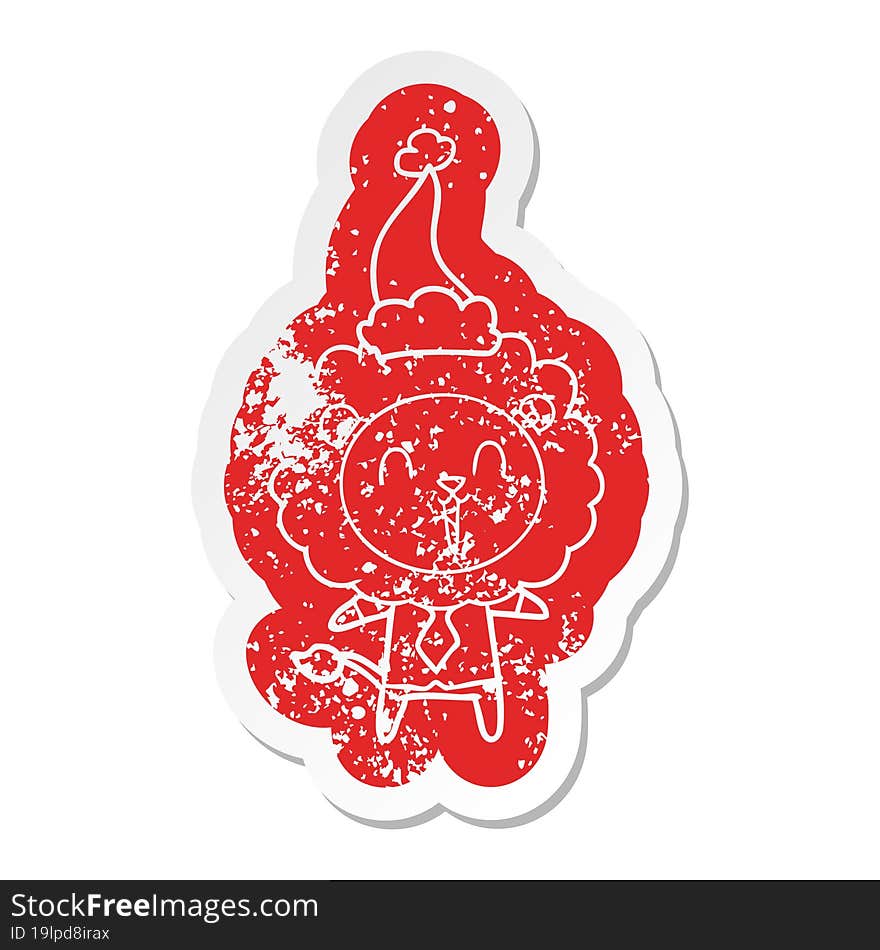 laughing lion quirky cartoon distressed sticker of a wearing santa hat