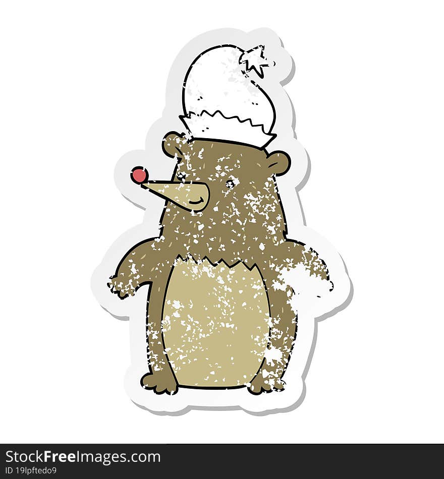 distressed sticker of a cartoon bear wearing christmas hat