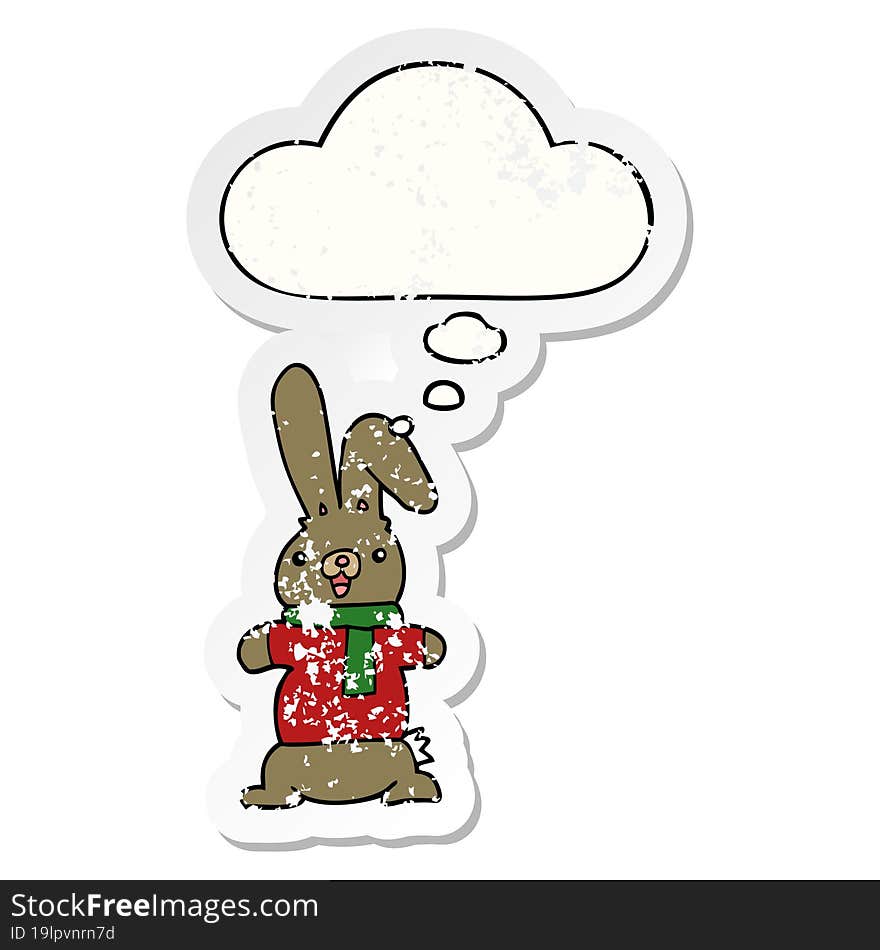 cartoon rabbit and thought bubble as a distressed worn sticker