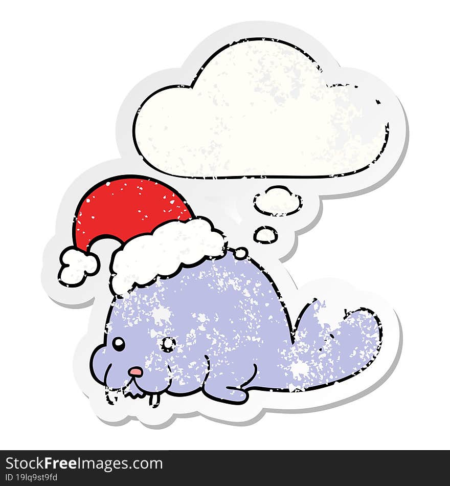 cartoon christmas walrus and thought bubble as a distressed worn sticker