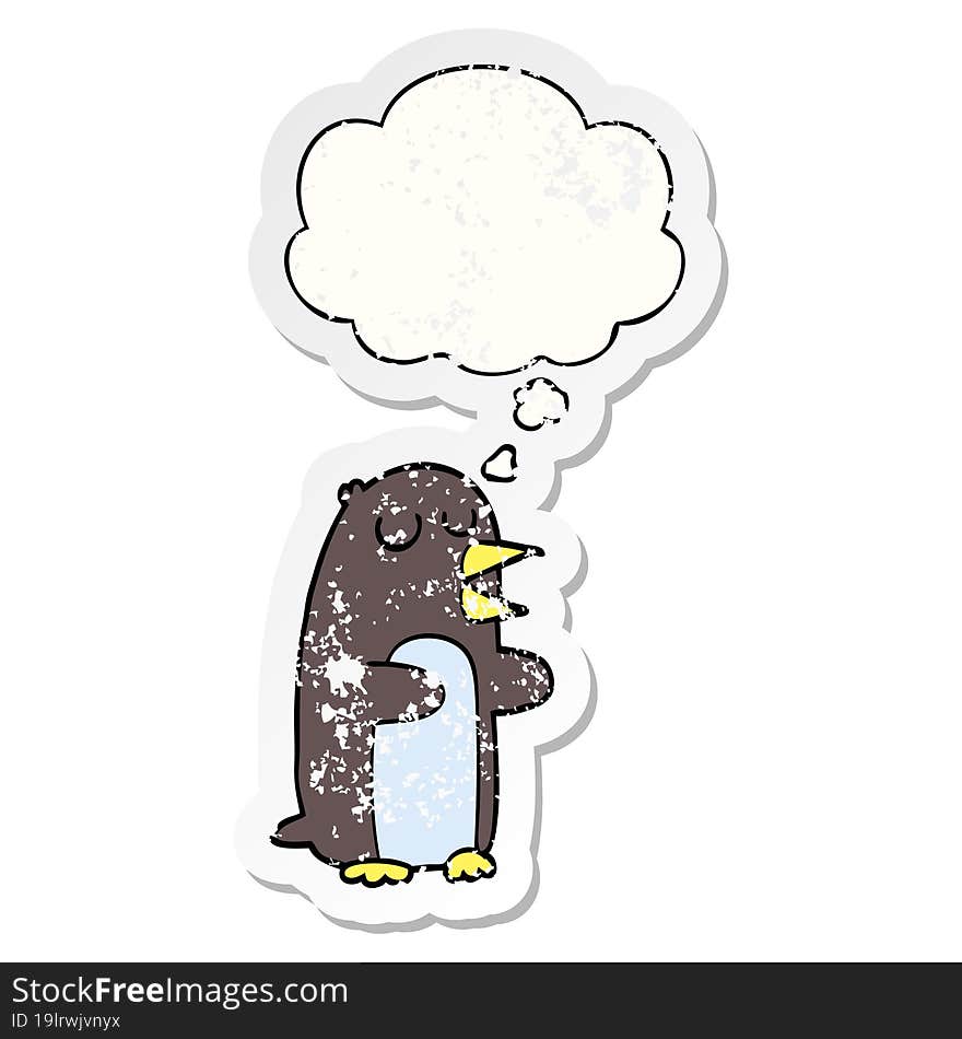 cartoon penguin and thought bubble as a distressed worn sticker