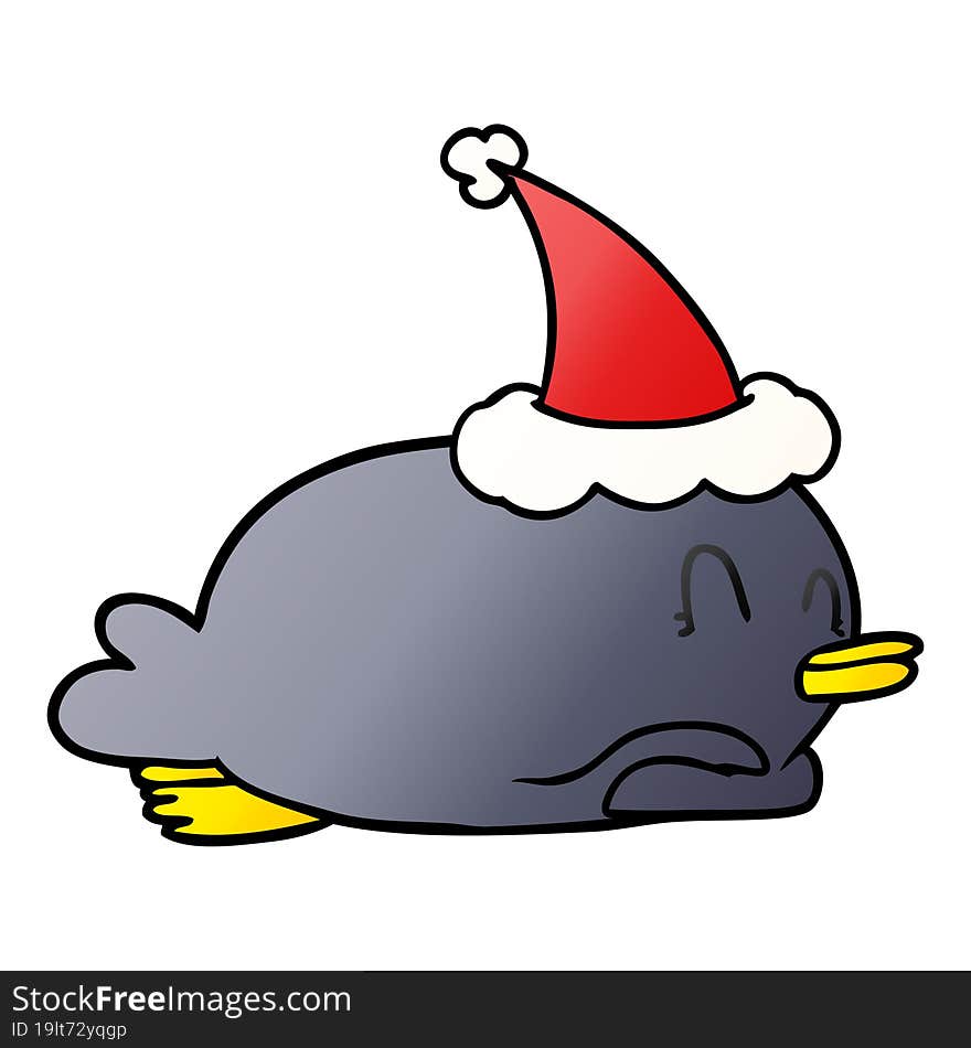 penguin lying on belly wearing santa hat