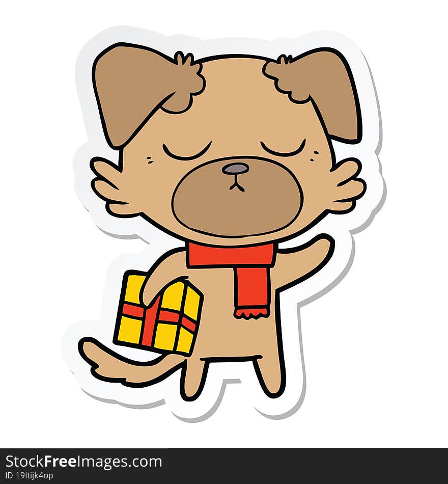 sticker of a cute cartoon dog with christmas present