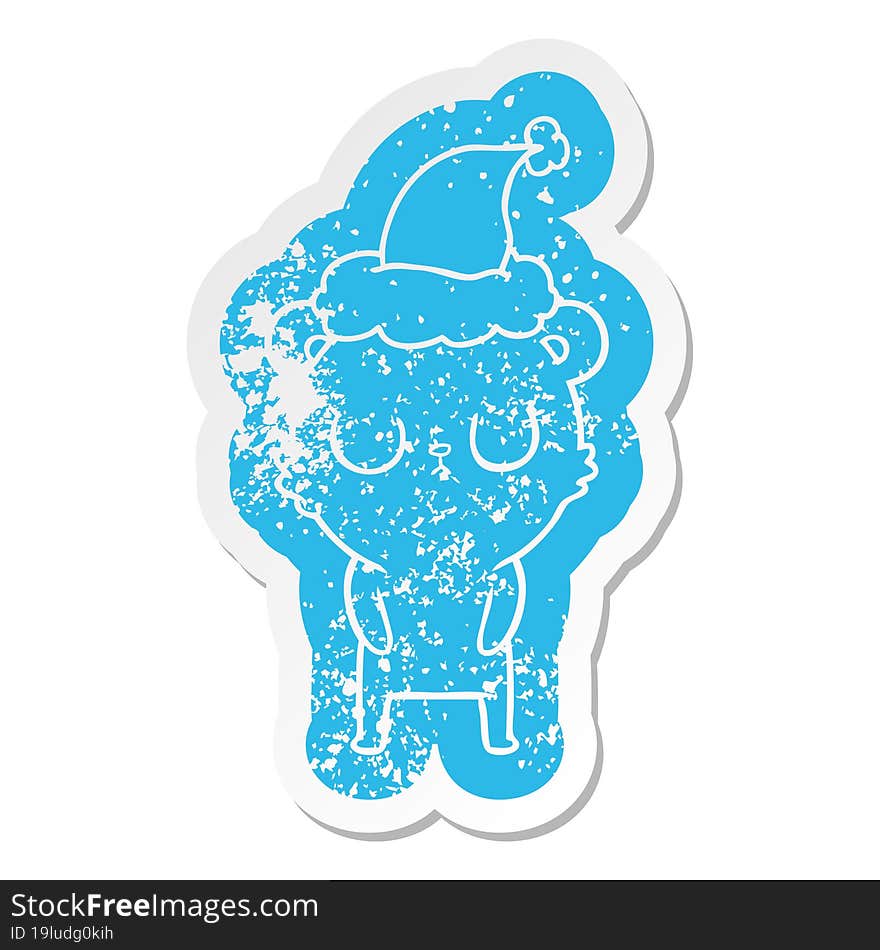 peaceful cartoon distressed sticker of a bear wearing santa hat