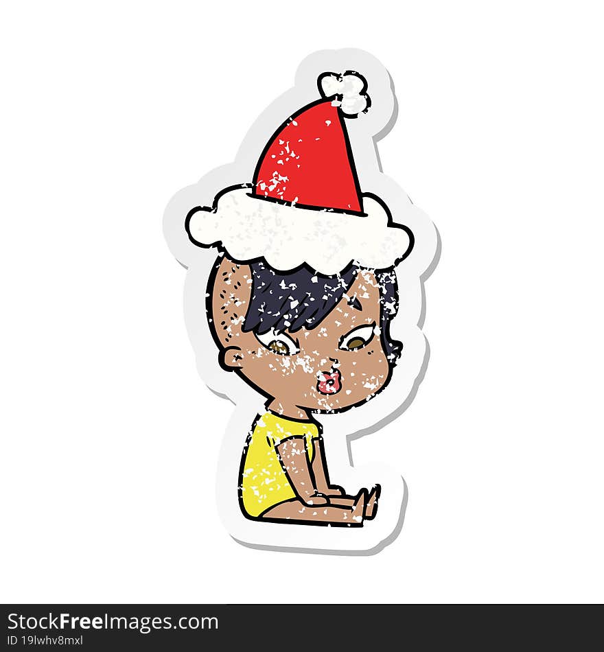 distressed sticker cartoon of a surprised girl wearing santa hat