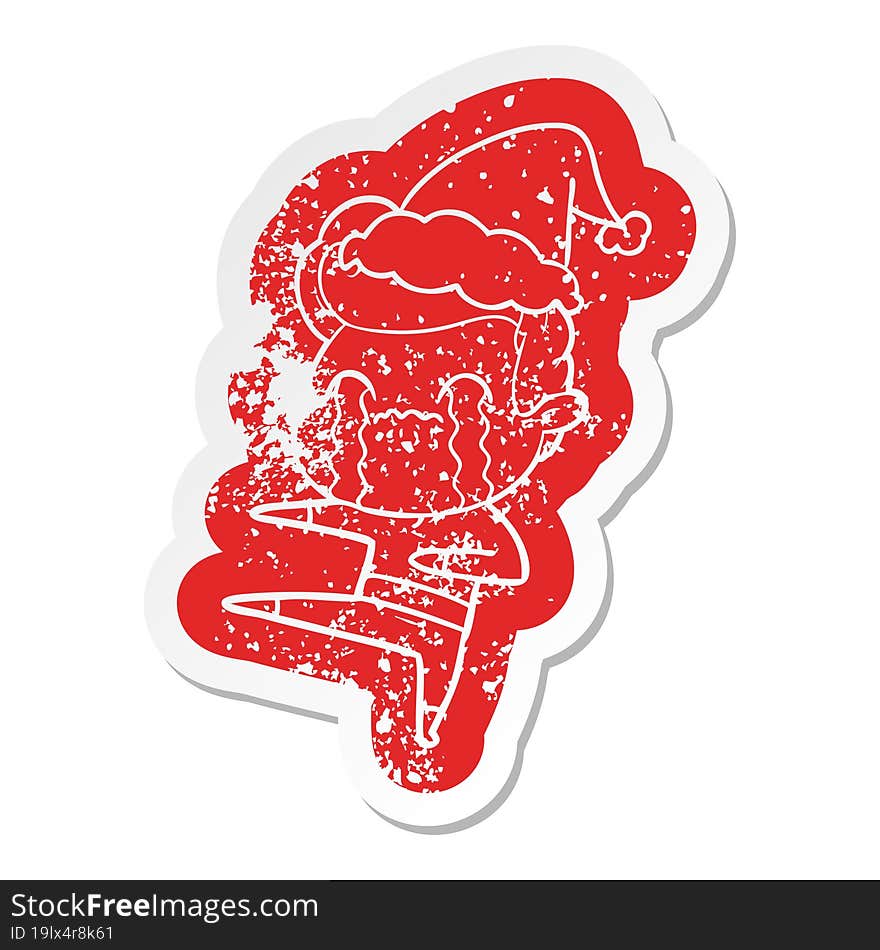 cartoon distressed sticker of a man crying wearing santa hat