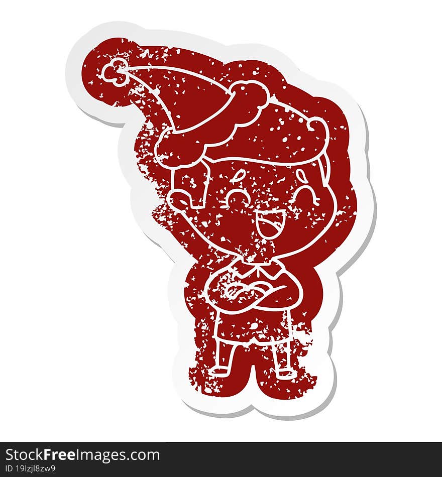 quirky cartoon distressed sticker of a laughing man wearing santa hat