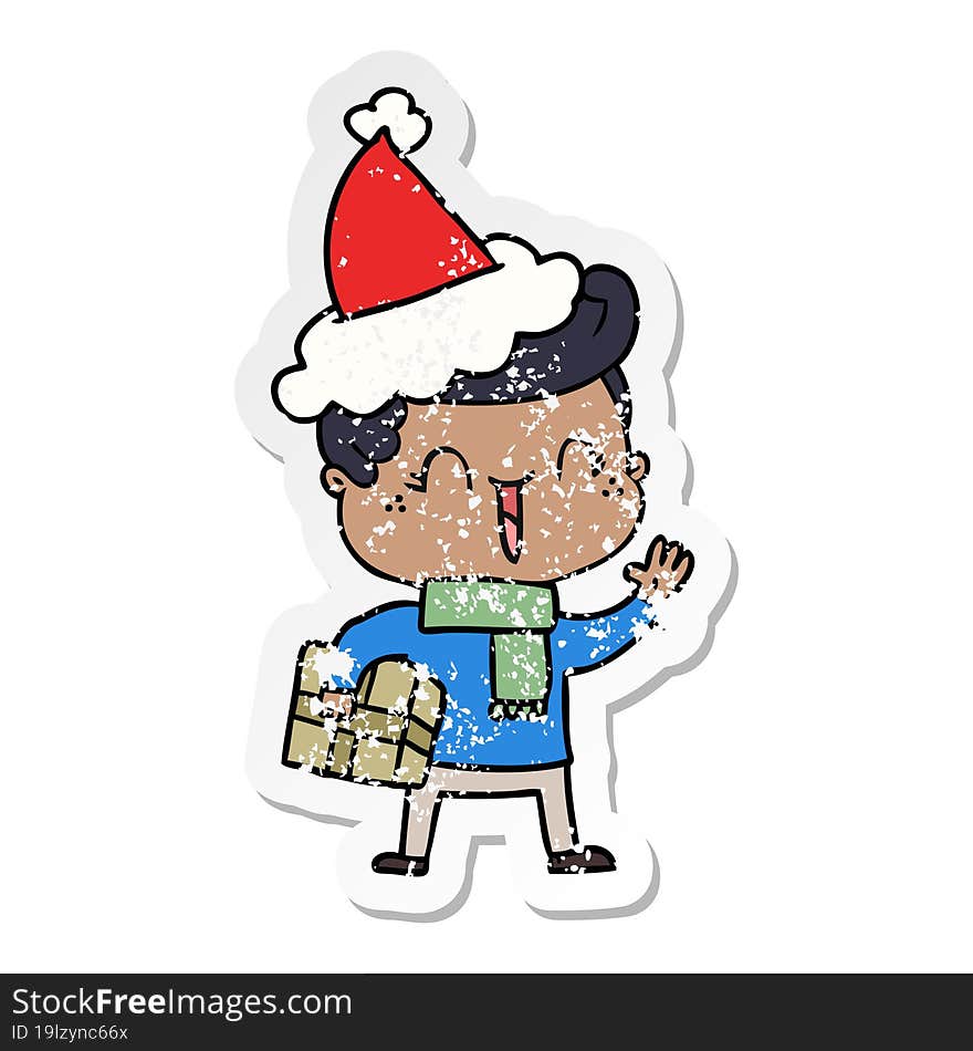 Distressed Sticker Cartoon Of A Laughing Boy Wearing Santa Hat