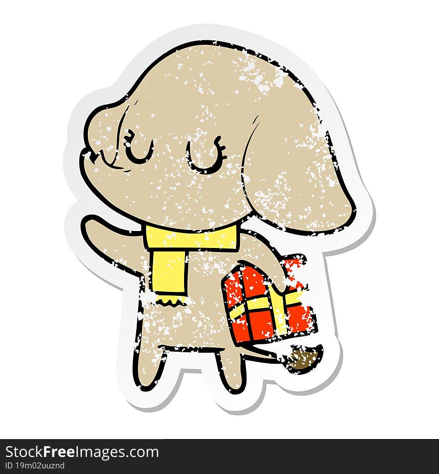 distressed sticker of a cute cartoon elephant with gift