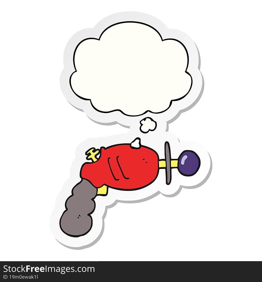 cartoon ray gun and thought bubble as a printed sticker