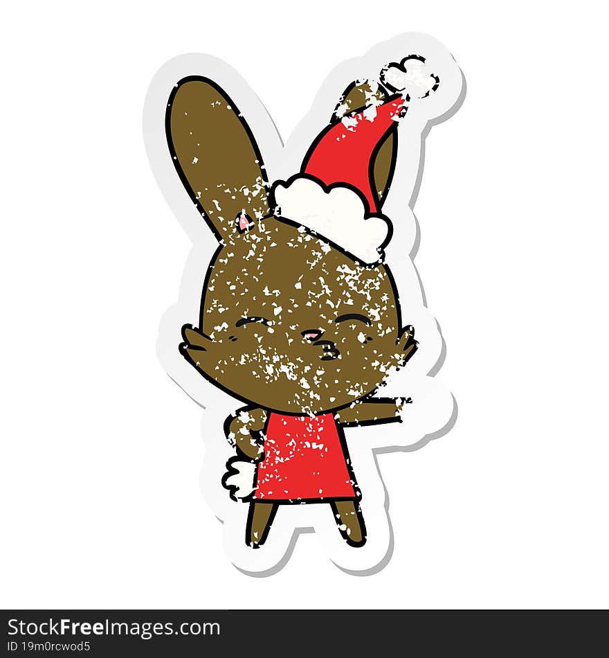 curious bunny hand drawn distressed sticker cartoon of a wearing santa hat. curious bunny hand drawn distressed sticker cartoon of a wearing santa hat