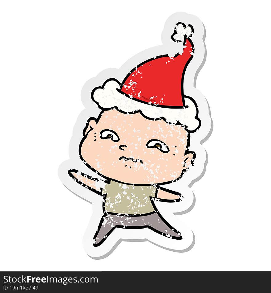 distressed sticker cartoon of a nervous man wearing santa hat