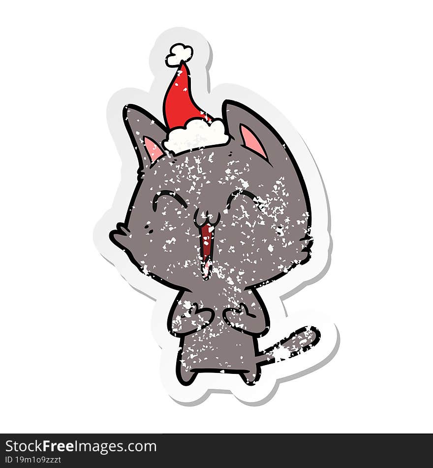 happy distressed sticker cartoon of a cat wearing santa hat