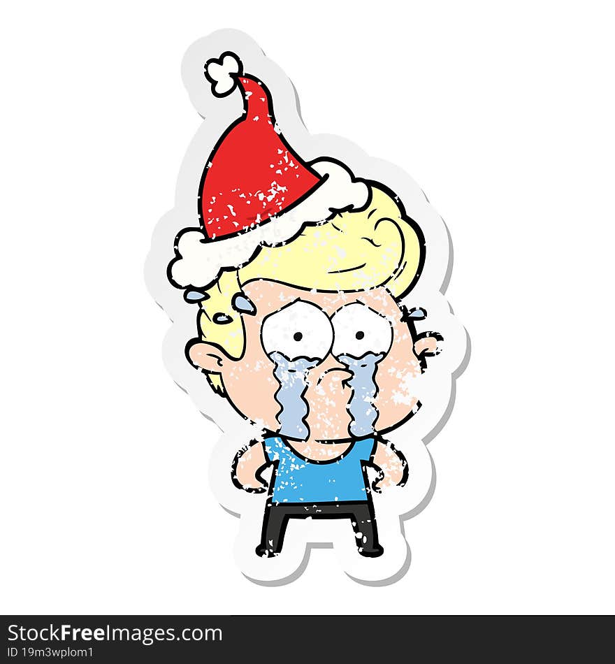 distressed sticker cartoon of a crying man wearing santa hat