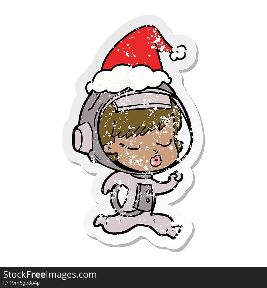 distressed sticker cartoon of a pretty astronaut girl running wearing santa hat