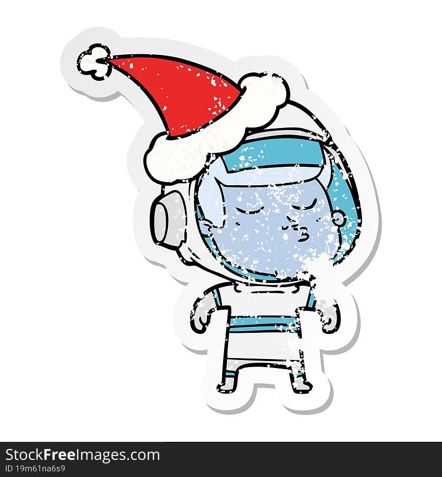 distressed sticker cartoon of a confident astronaut wearing santa hat