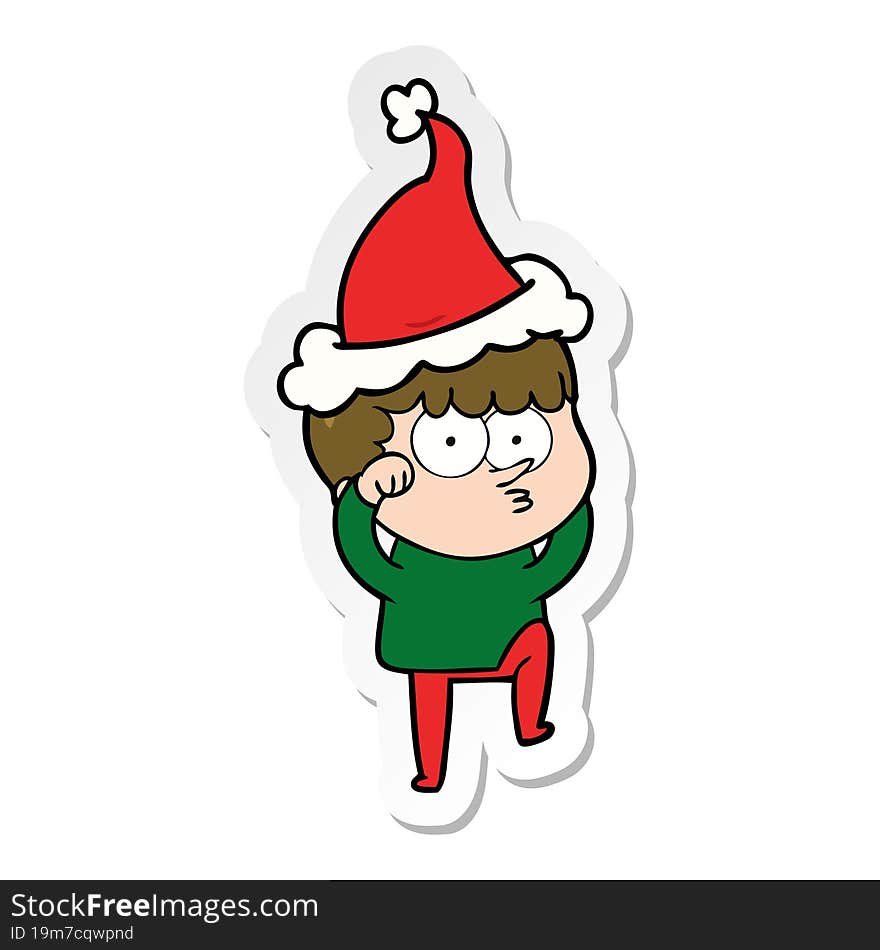 sticker cartoon of a curious boy rubbing eyes in disbelief wearing santa hat