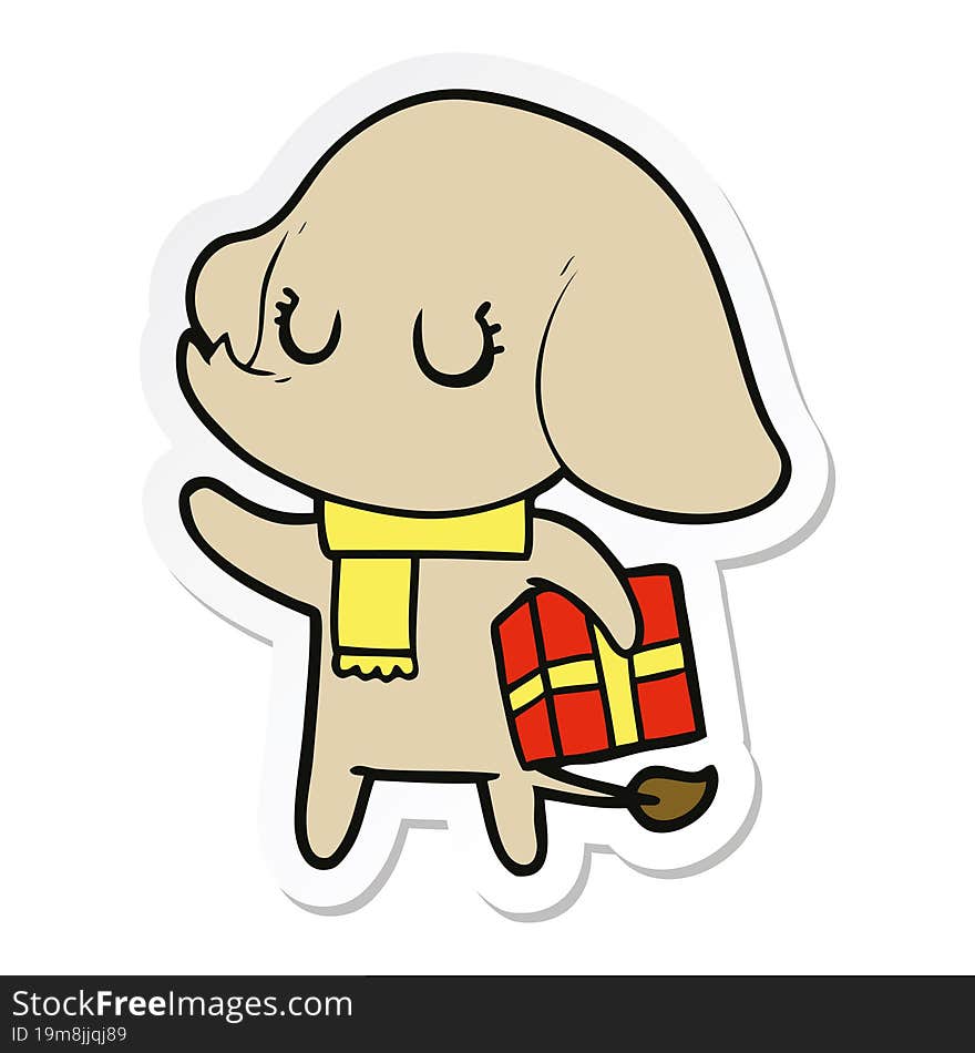 sticker of a cute cartoon elephant with gift