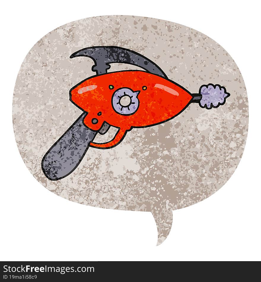 cartoon ray gun and speech bubble in retro textured style