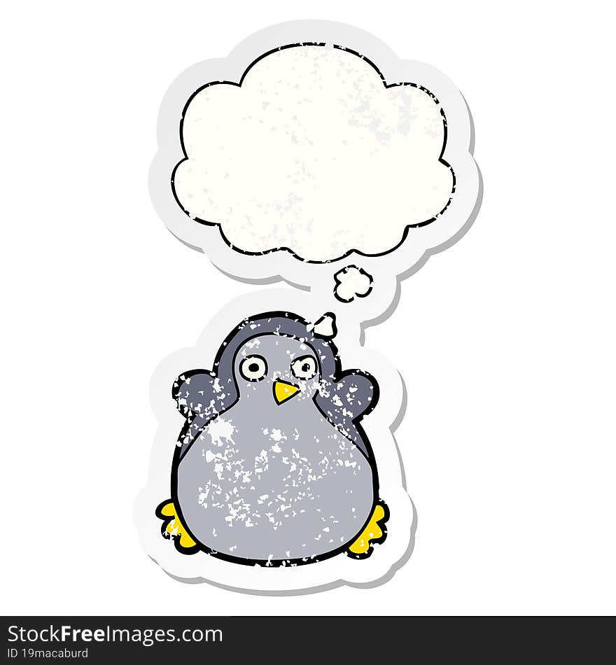 cartoon penguin and thought bubble as a distressed worn sticker