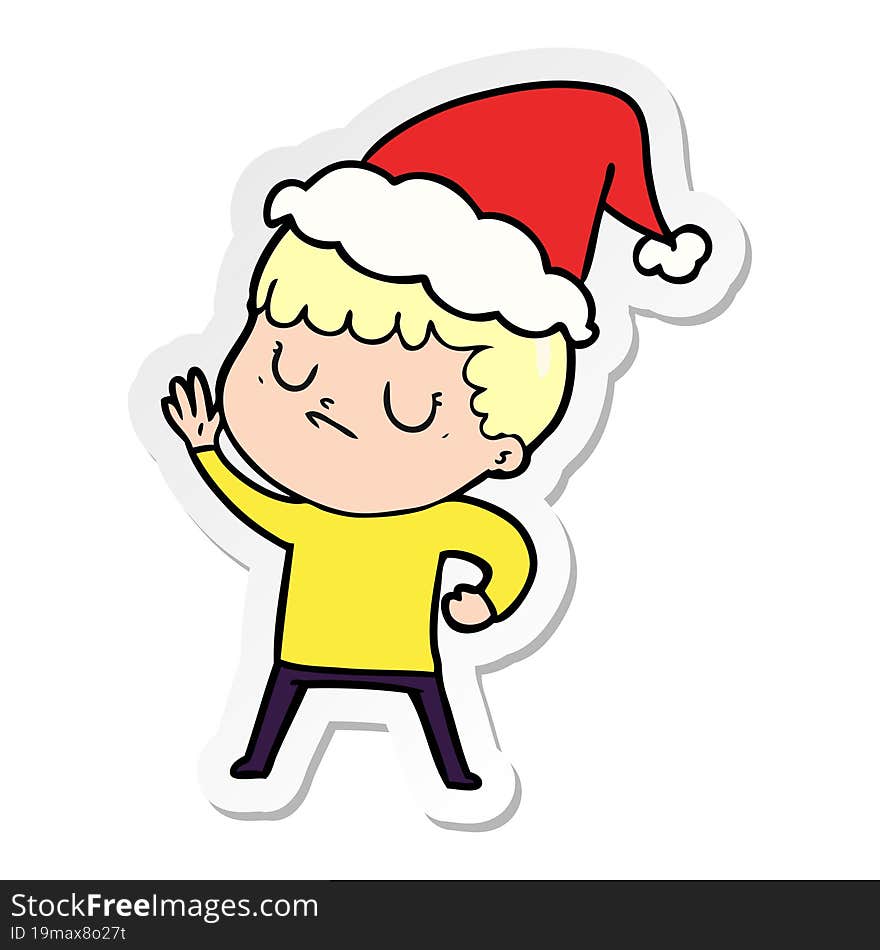 sticker cartoon of a grumpy boy wearing santa hat