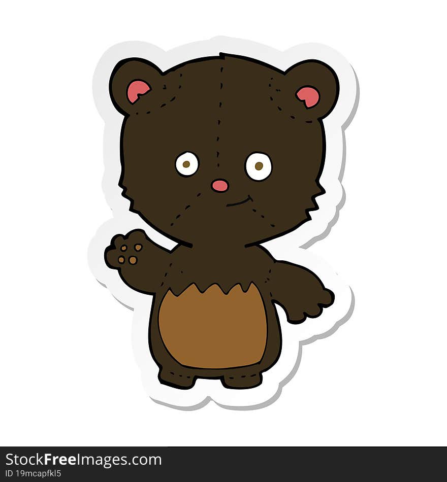 sticker of a cartoon little black bear waving