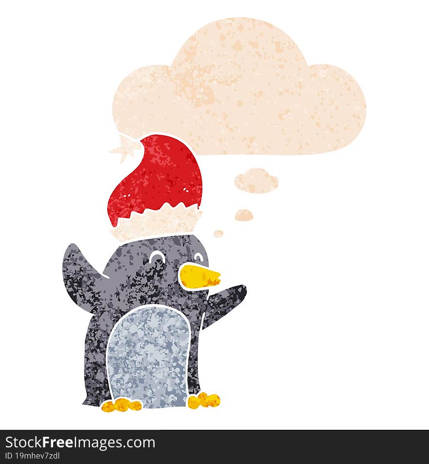 cute cartoon christmas penguin and thought bubble in retro textured style