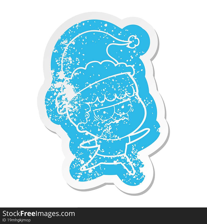 quirky cartoon distressed sticker of a annoyed man wearing santa hat