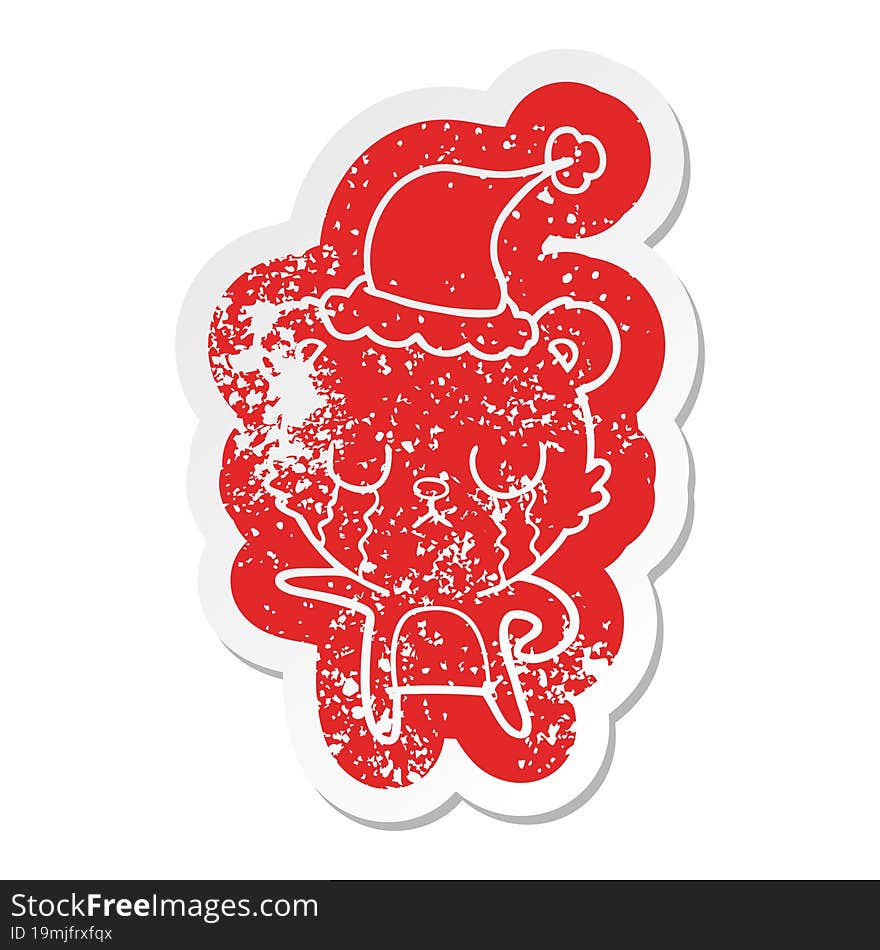 crying cartoon distressed sticker of a bear wearing santa hat