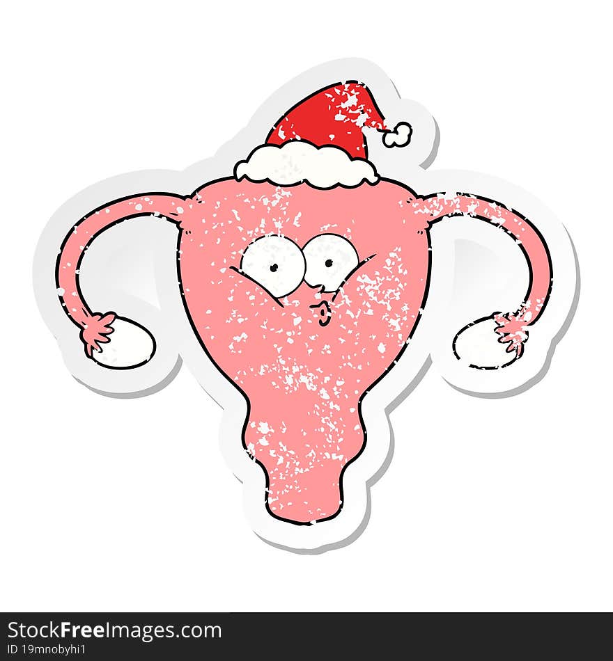 distressed sticker cartoon of a uterus wearing santa hat