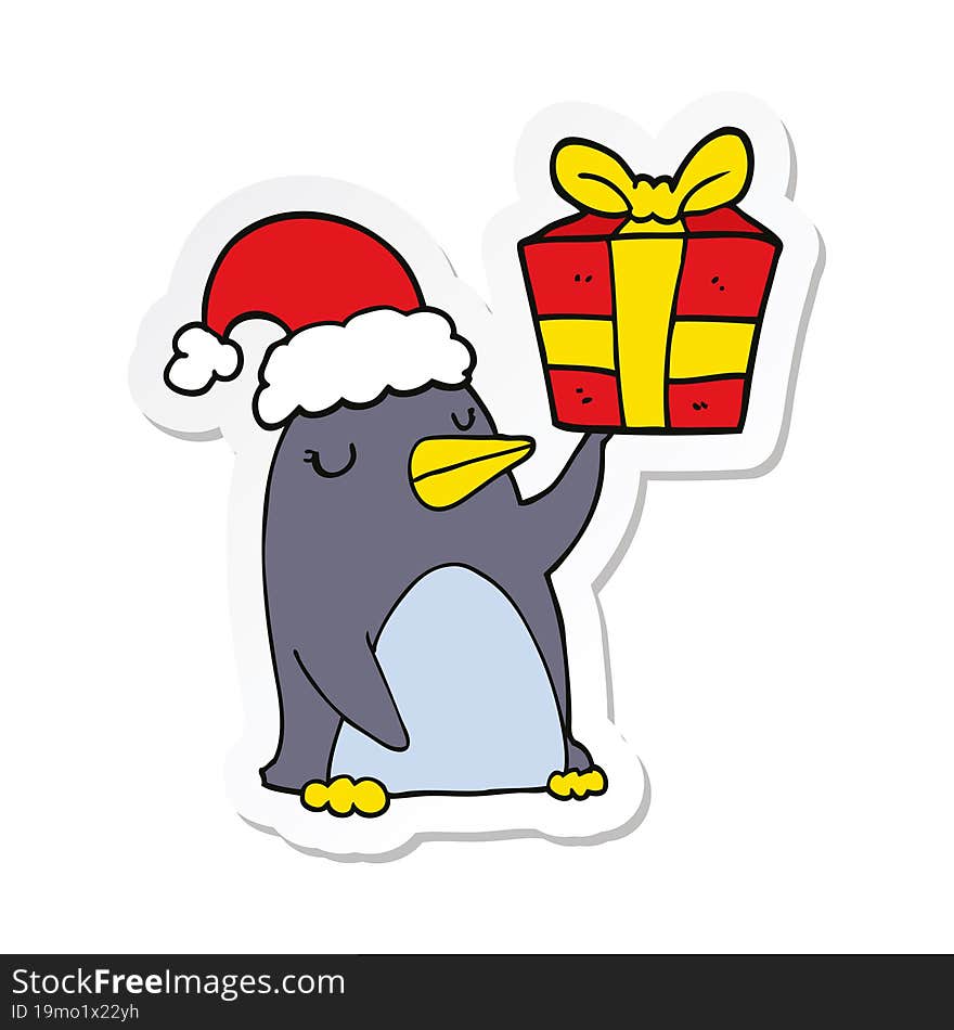 sticker of a cartoon penguin with christmas present