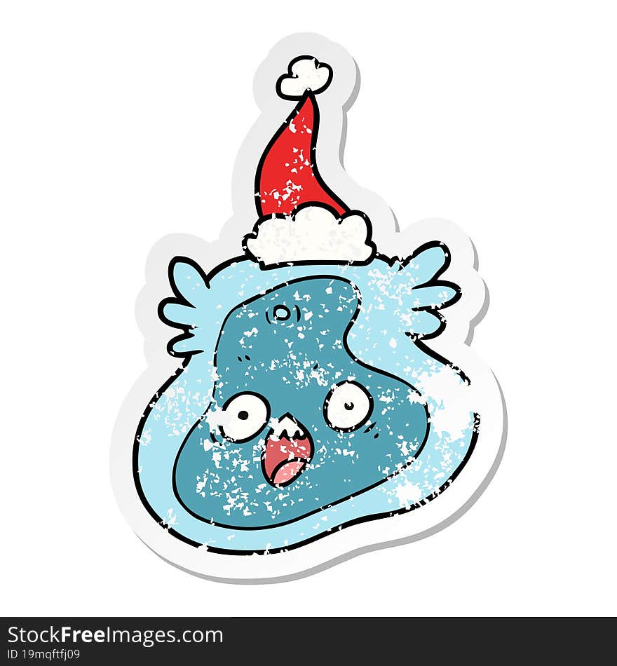 distressed sticker cartoon of a germ wearing santa hat