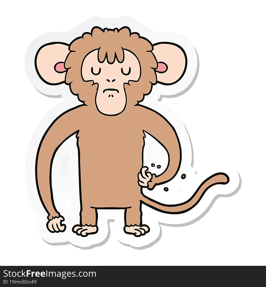 sticker of a cartoon monkey scratching