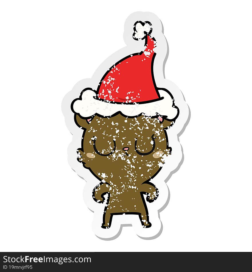 peaceful distressed sticker cartoon of a bear wearing santa hat